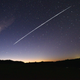 This long-exposure image shows a trail of a group of SpaceX’s Starlink satellites passing over Uruguay on Feb. 7, 2021.